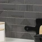 graphite fragments 2x8 textured ceramic wall install